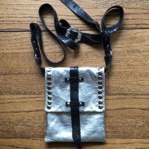Silver with black skin strap crossover bag